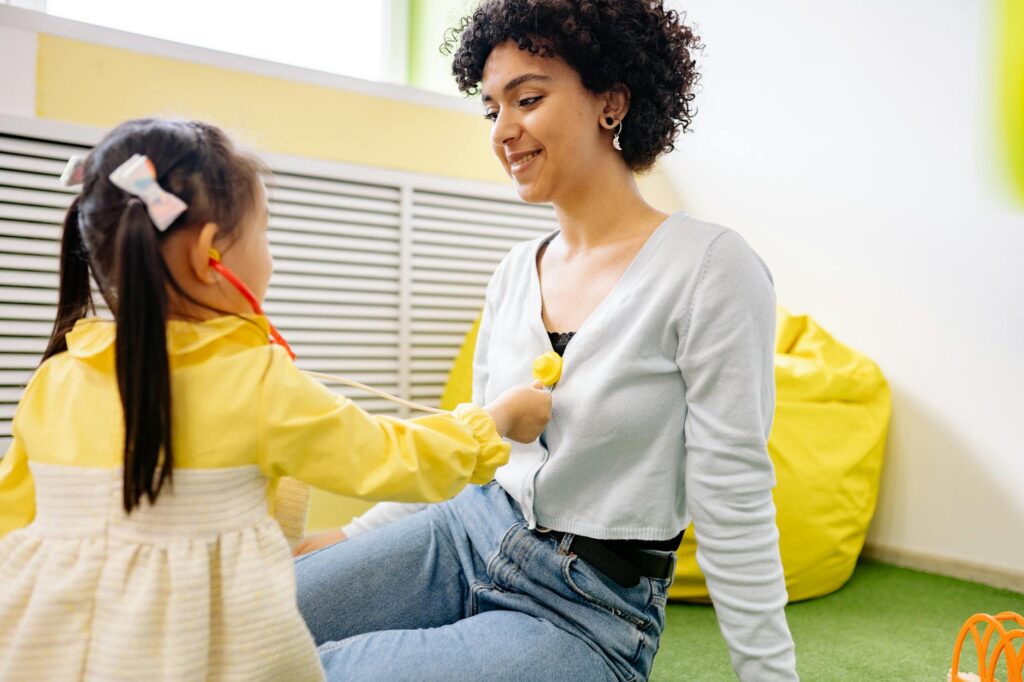 kindergarten teacher children playing quality