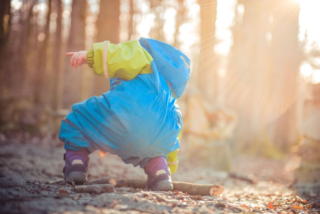 toddler playing freely natural environment
