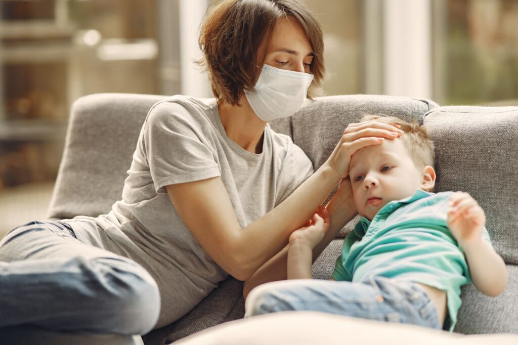 mother comforting sick child
