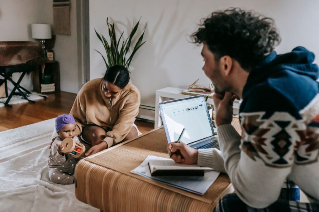 parents with baby paperwork