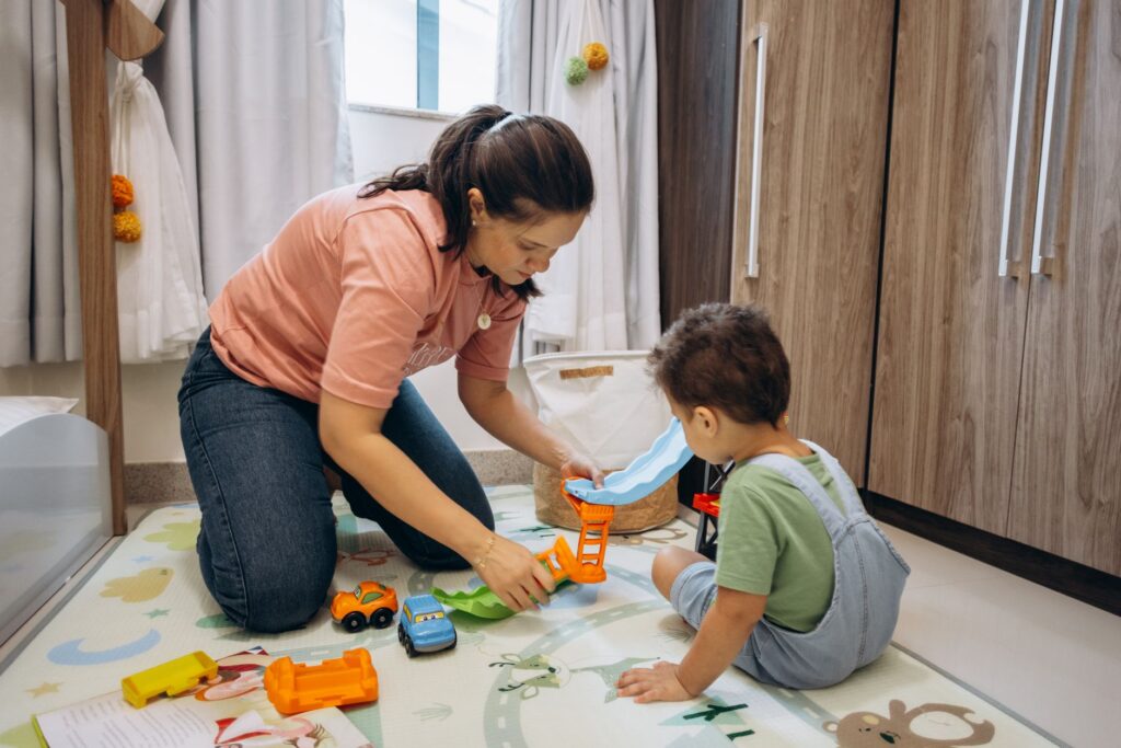 daycare provider playing with toddler home