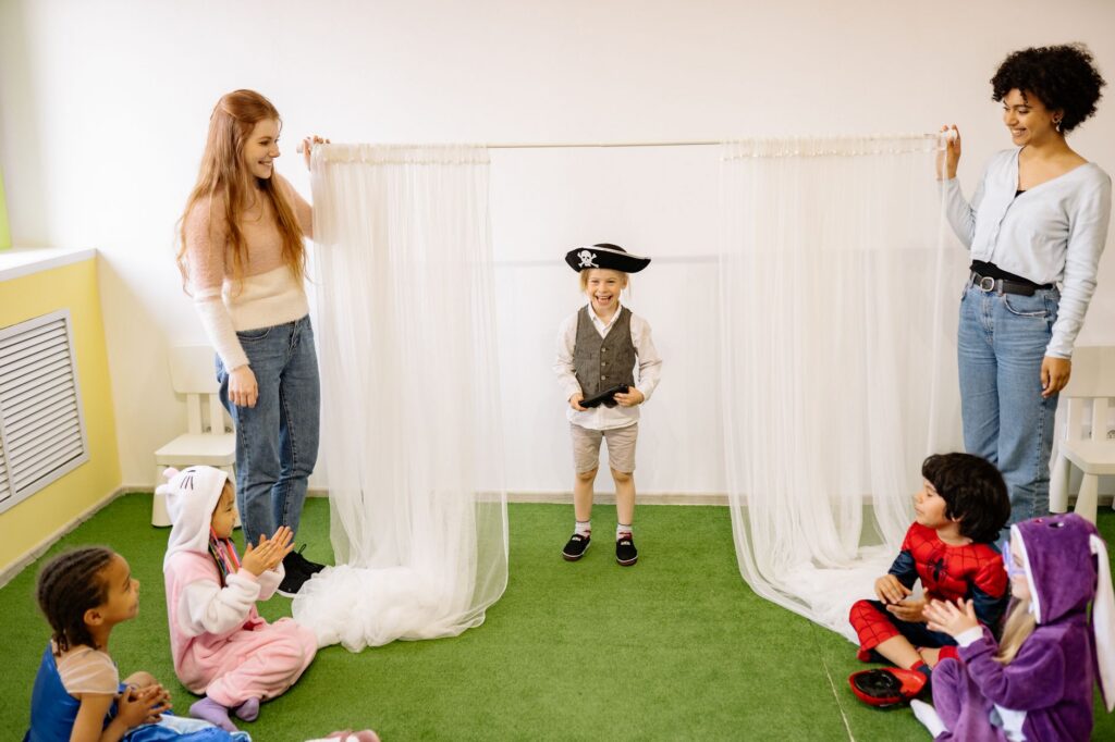 kindergarten children playing teacher